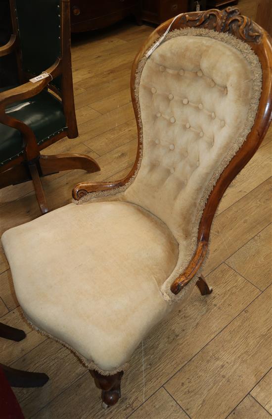 A Victorian walnut spoon back nursing chair